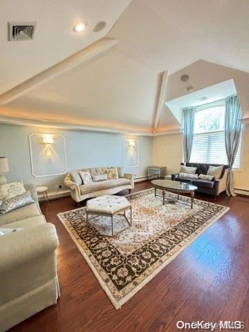 living room with vaulted ceiling with beams and dark hardwood / wood-style flooring