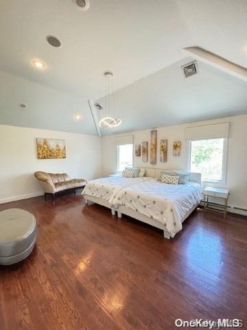 bedroom with a baseboard radiator, vaulted ceiling, and dark wood-type flooring