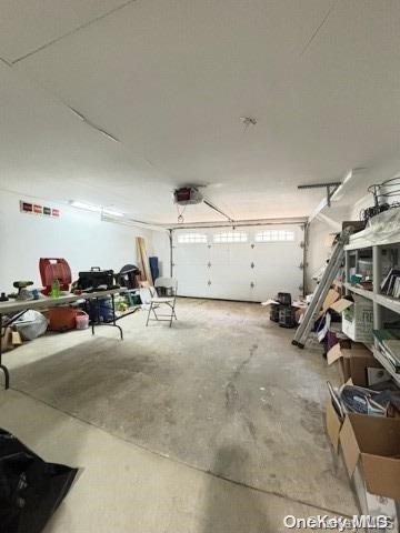 garage featuring a garage door opener