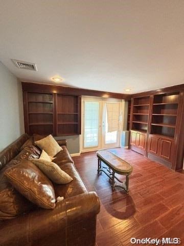 living room featuring dark hardwood / wood-style floors and french doors