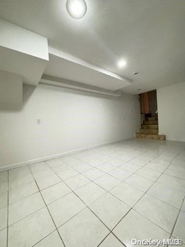 basement with light tile patterned floors