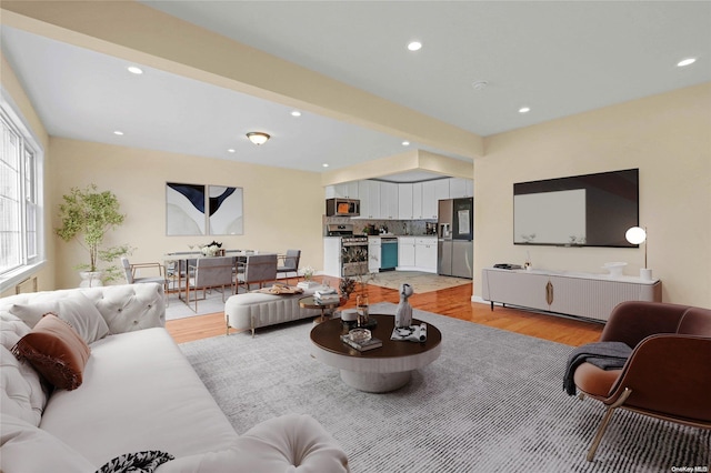 living room with light hardwood / wood-style flooring