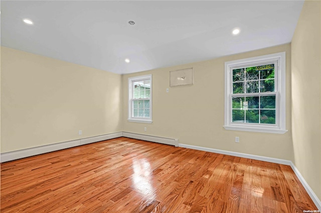 unfurnished room with light hardwood / wood-style floors