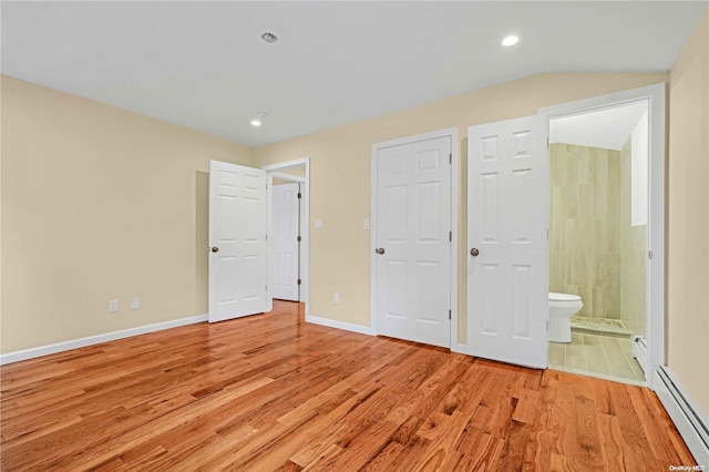 unfurnished bedroom with ensuite bathroom, light wood-type flooring, and a baseboard radiator