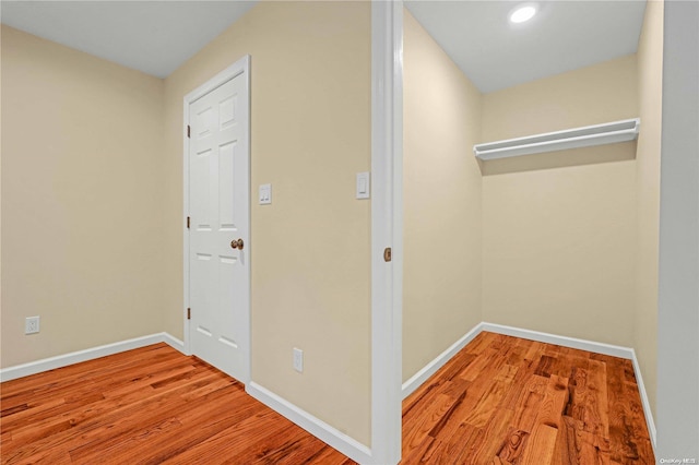 corridor with light wood-type flooring