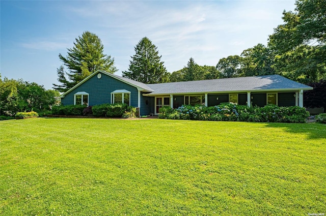 ranch-style house with a front lawn