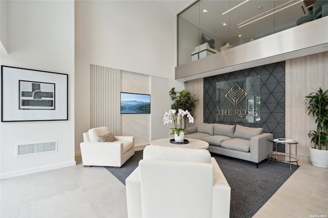 living room with a towering ceiling