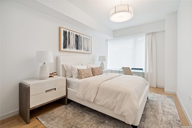 bedroom with light hardwood / wood-style flooring