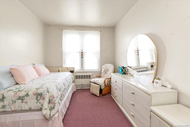 bedroom with carpet flooring and radiator heating unit