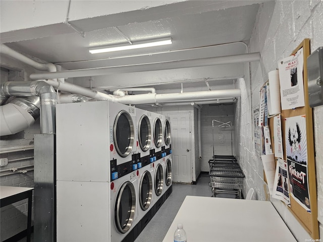 laundry area with washer and clothes dryer and stacked washer / dryer