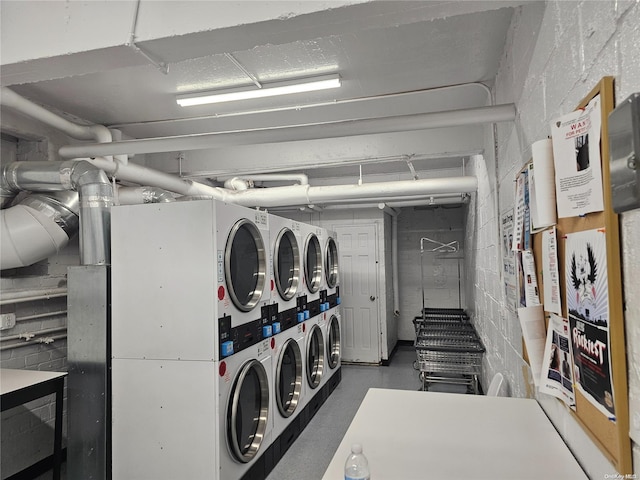 33-04 91st St Unit 5W, Jackson Heights, NY 11372 - community laundry room featuring stacked washer / drying machine and separate washer and dryer