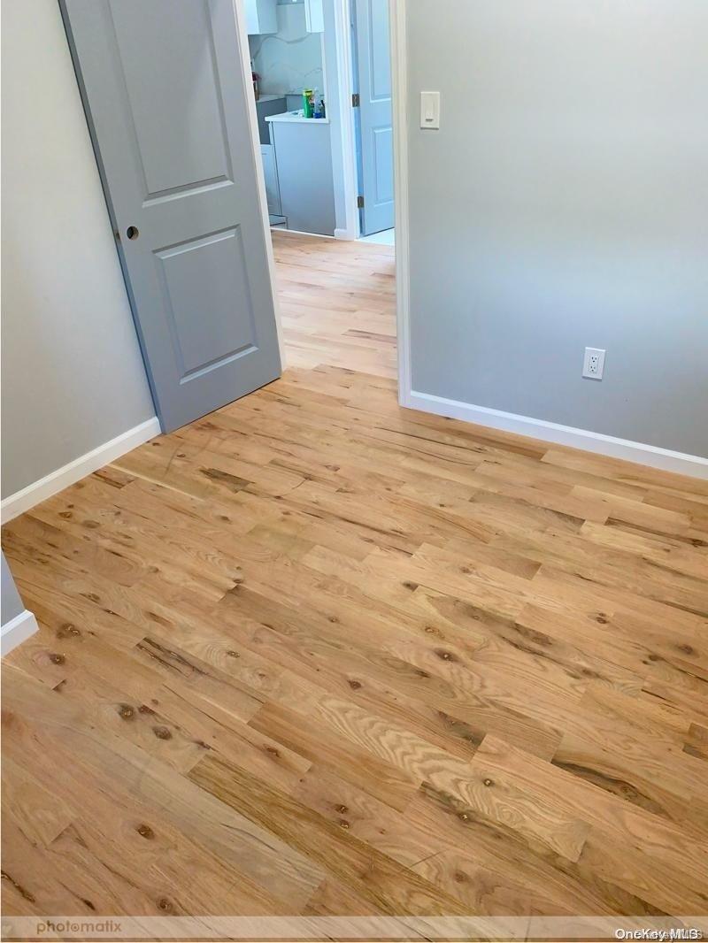 unfurnished room with light hardwood / wood-style floors