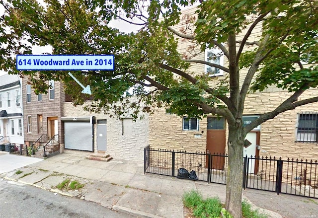 614 Woodward Ave, Ridgewood, NY 11385 - exterior space with stone siding and entry steps
