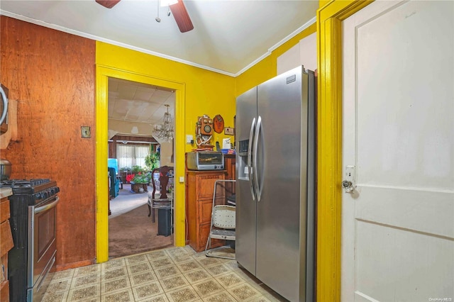 kitchen featuring ceiling fan, crown molding, light colored carpet, and stainless steel appliances