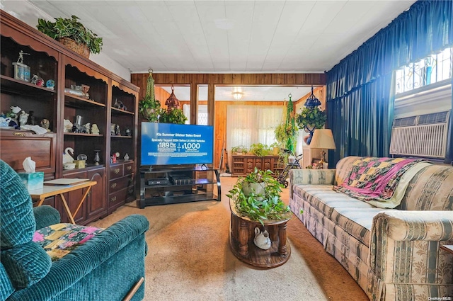 living room featuring carpet floors, cooling unit, and wooden walls