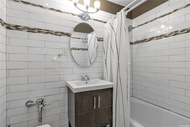 bathroom featuring vanity and shower / bath combo