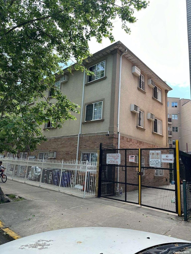 view of property featuring a wall mounted air conditioner