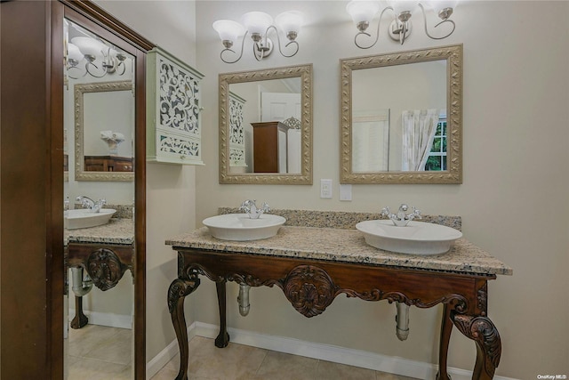 22 Saints Orchard Rd, Port Jefferson, NY 11777 - full bath featuring tile patterned floors, a chandelier, baseboards, and double sink