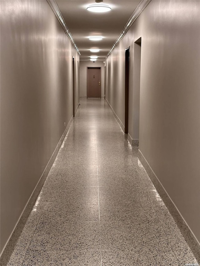 hallway featuring ornamental molding