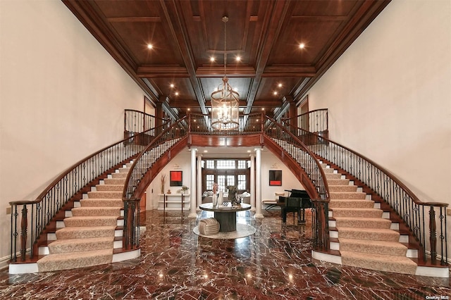 interior space featuring french doors, coffered ceiling, crown molding, an inviting chandelier, and wooden ceiling