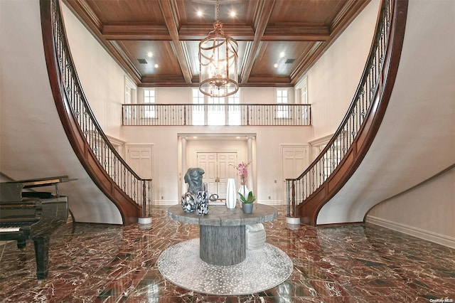 entrance foyer featuring a chandelier, beamed ceiling, wood ceiling, and coffered ceiling