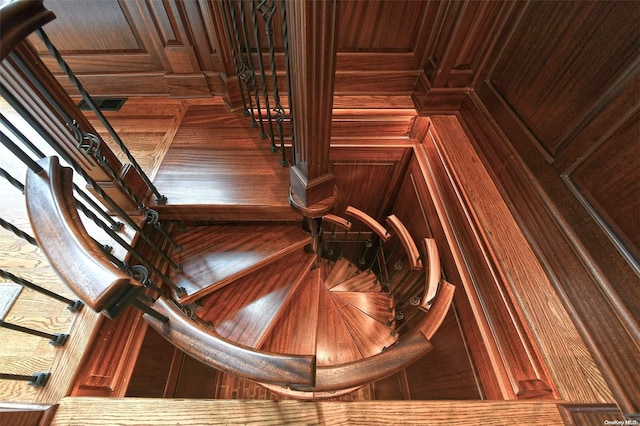 staircase with wood walls