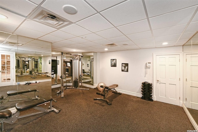 workout area with a paneled ceiling