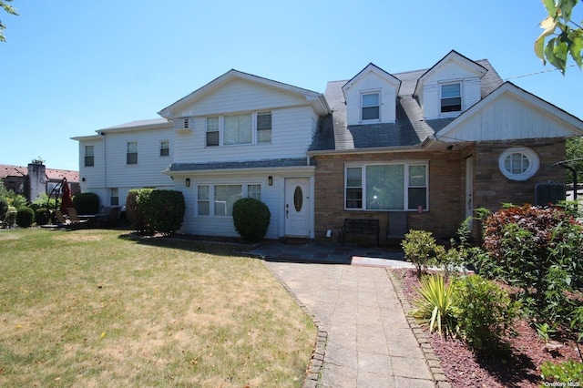 view of front of home with a front lawn