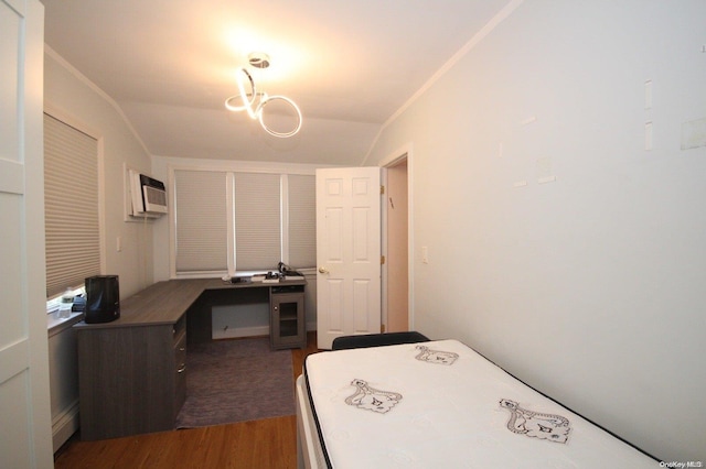 bedroom featuring a wall mounted air conditioner, dark hardwood / wood-style floors, vaulted ceiling, and crown molding