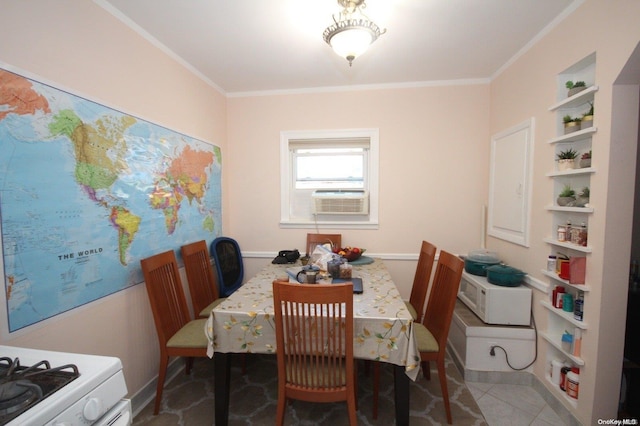 dining space featuring crown molding