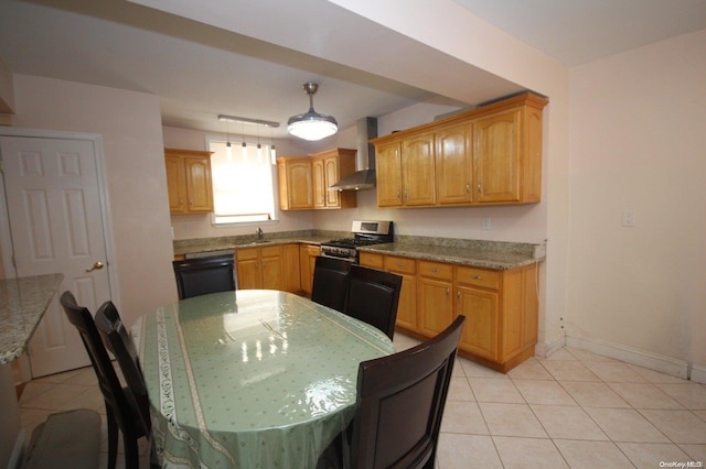 kitchen with stainless steel gas range oven, wall chimney exhaust hood, light tile patterned floors, black dishwasher, and decorative light fixtures