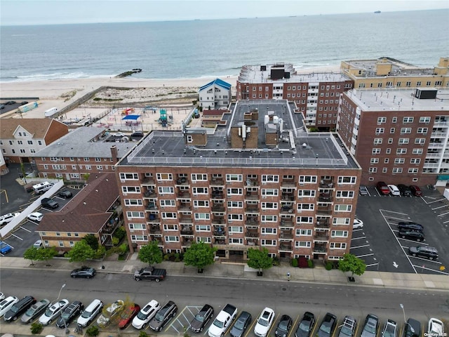 bird's eye view with a beach view and a water view