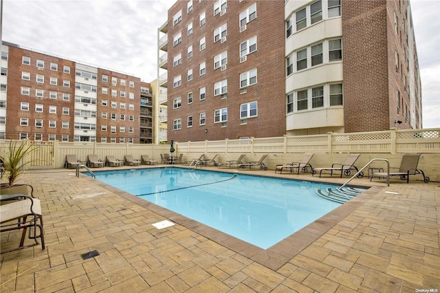 view of swimming pool featuring a patio