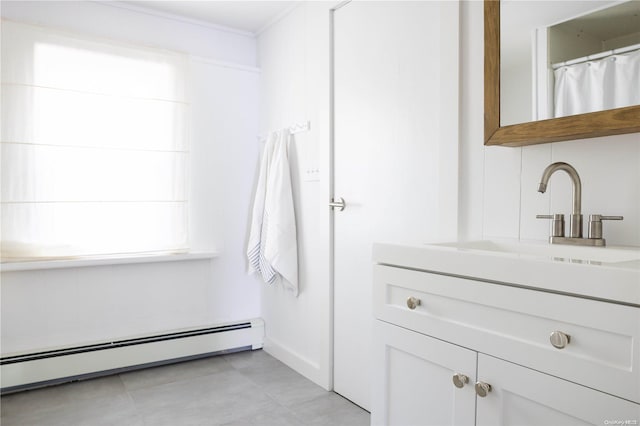 bathroom featuring vanity and a baseboard heating unit