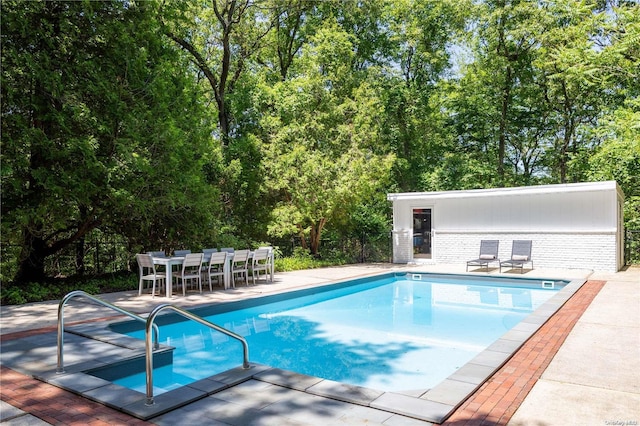 view of pool featuring a patio