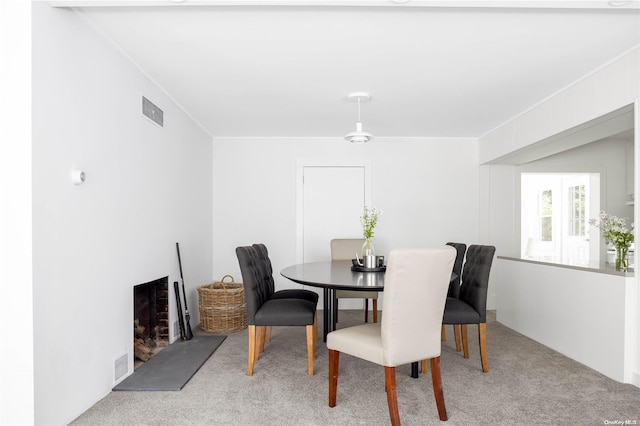 view of carpeted dining space