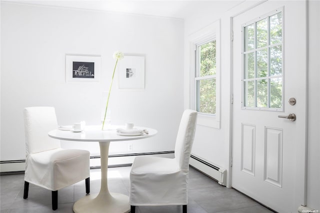 dining space with a baseboard radiator