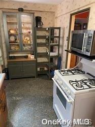 kitchen with white gas stove