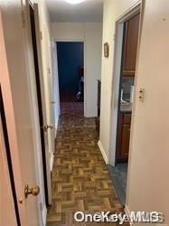 corridor featuring dark parquet floors