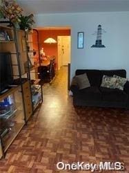 living room with dark parquet floors