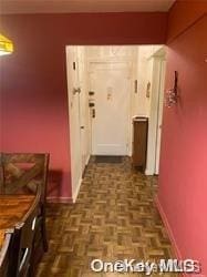 hall with dark parquet floors