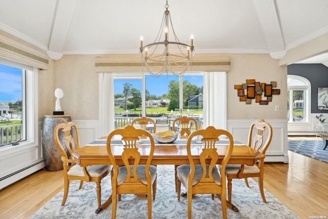 dining space featuring a chandelier, light hardwood / wood-style floors, a baseboard radiator, and beamed ceiling