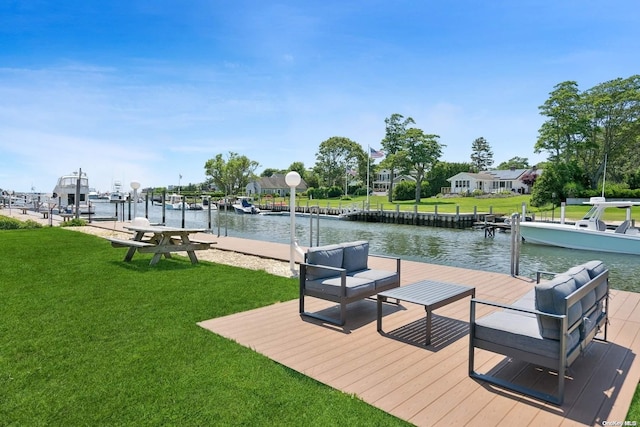 view of dock with a water view and a yard