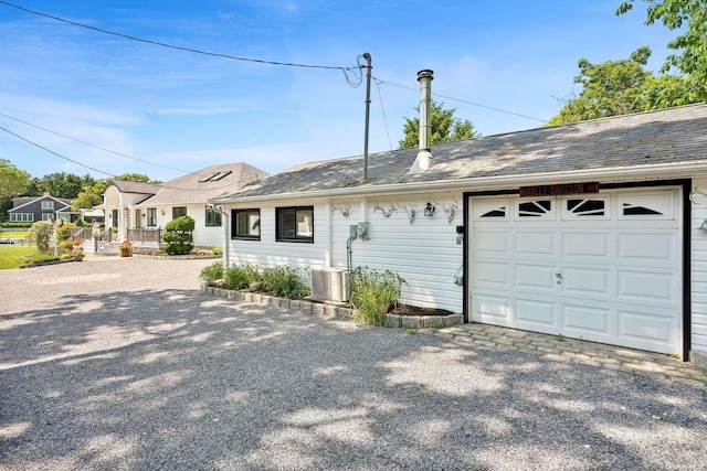 ranch-style house featuring a garage