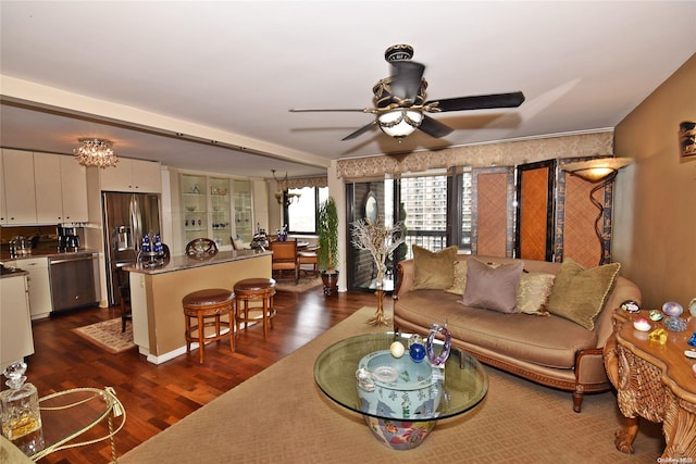 living room with ceiling fan and dark hardwood / wood-style floors