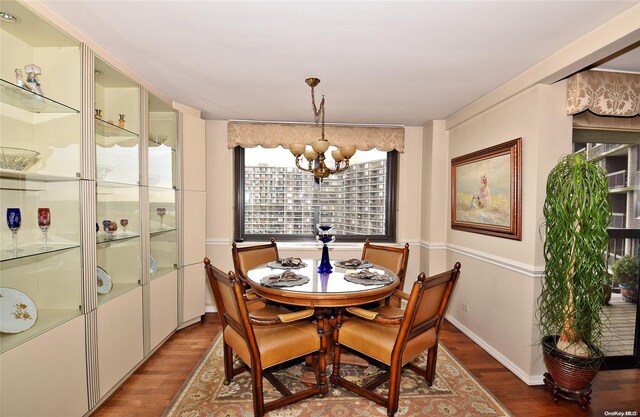 dining room featuring a chandelier and hardwood / wood-style flooring