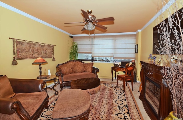 sitting room featuring ceiling fan and crown molding