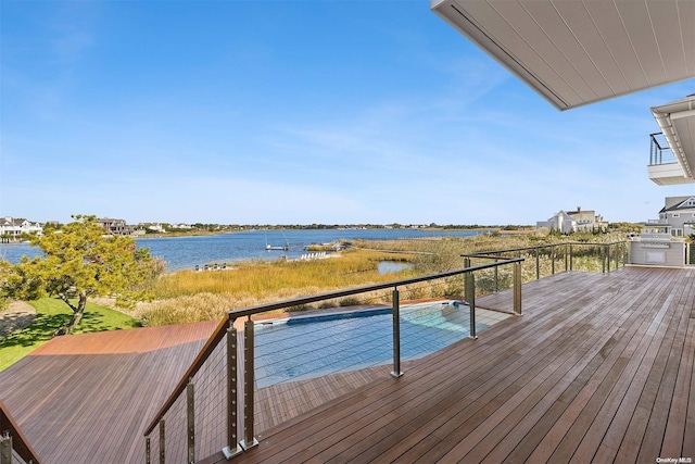 wooden deck featuring a water view