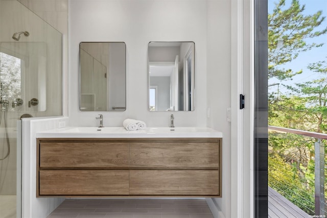 bathroom featuring tile patterned floors, vanity, and walk in shower