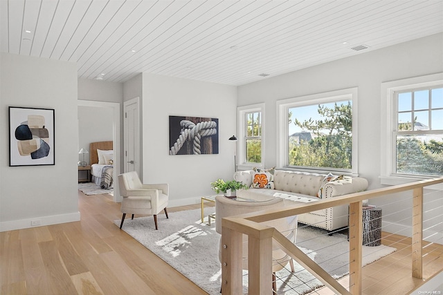 interior space with wood ceiling, hardwood / wood-style floors, and a healthy amount of sunlight